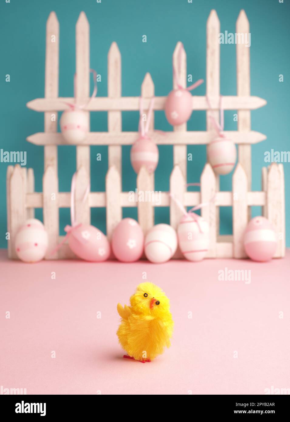 Cute chick with Easter eggs background Stock Photo
