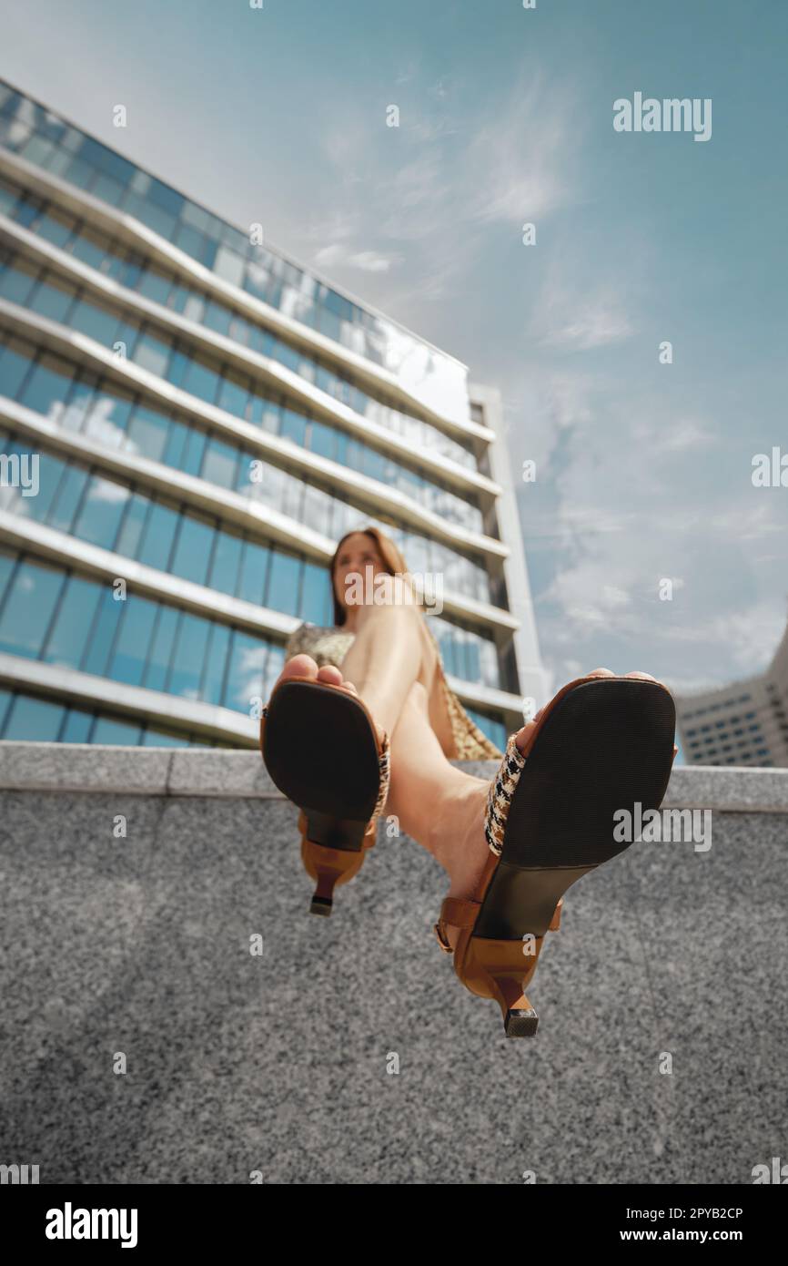 Low angle view at soles of female sandals Stock Photo