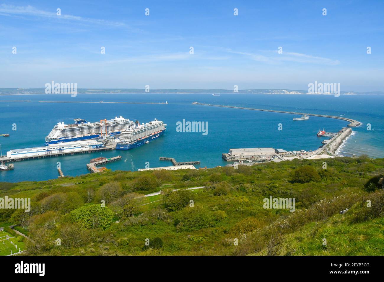 Portland, Dorset, UK.  3rd May 2023.  General view looking towards Portland Port at Castletown on the Isle of Portland in Dorset where the accommodation barge Bibby Stockholm is due to be berthed for at least 18 months to house asylum seekers.  The Port is a busy destination for cruise ships with the Celebrity Apex and Mein Schiff 3 docked today.  Picture Credit: Graham Hunt/Alamy Live News Stock Photo