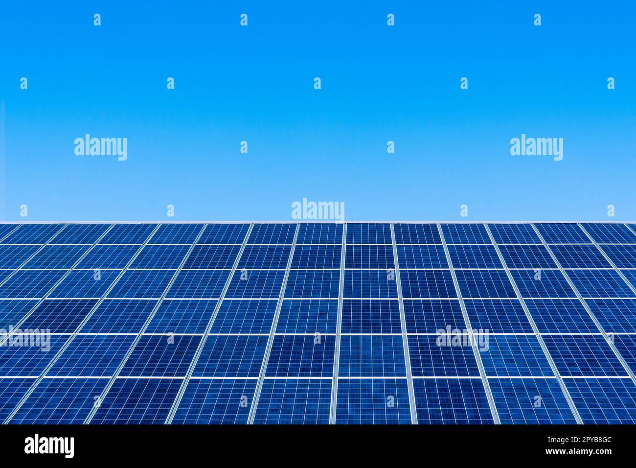 Solar panel on clear blue sky background Stock Photo