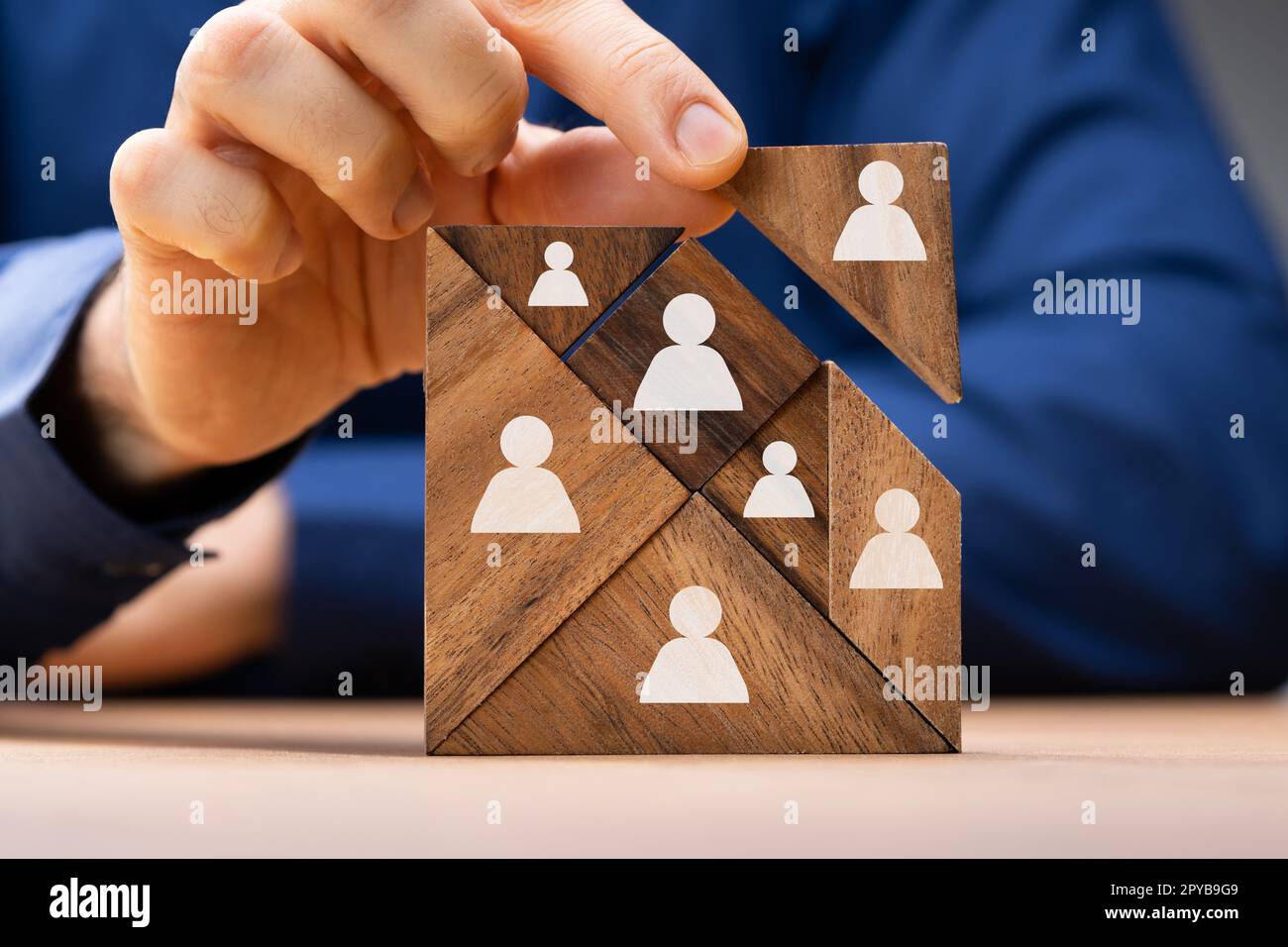 HR Recruitment Hand Making Tangram Puzzle Stock Photo