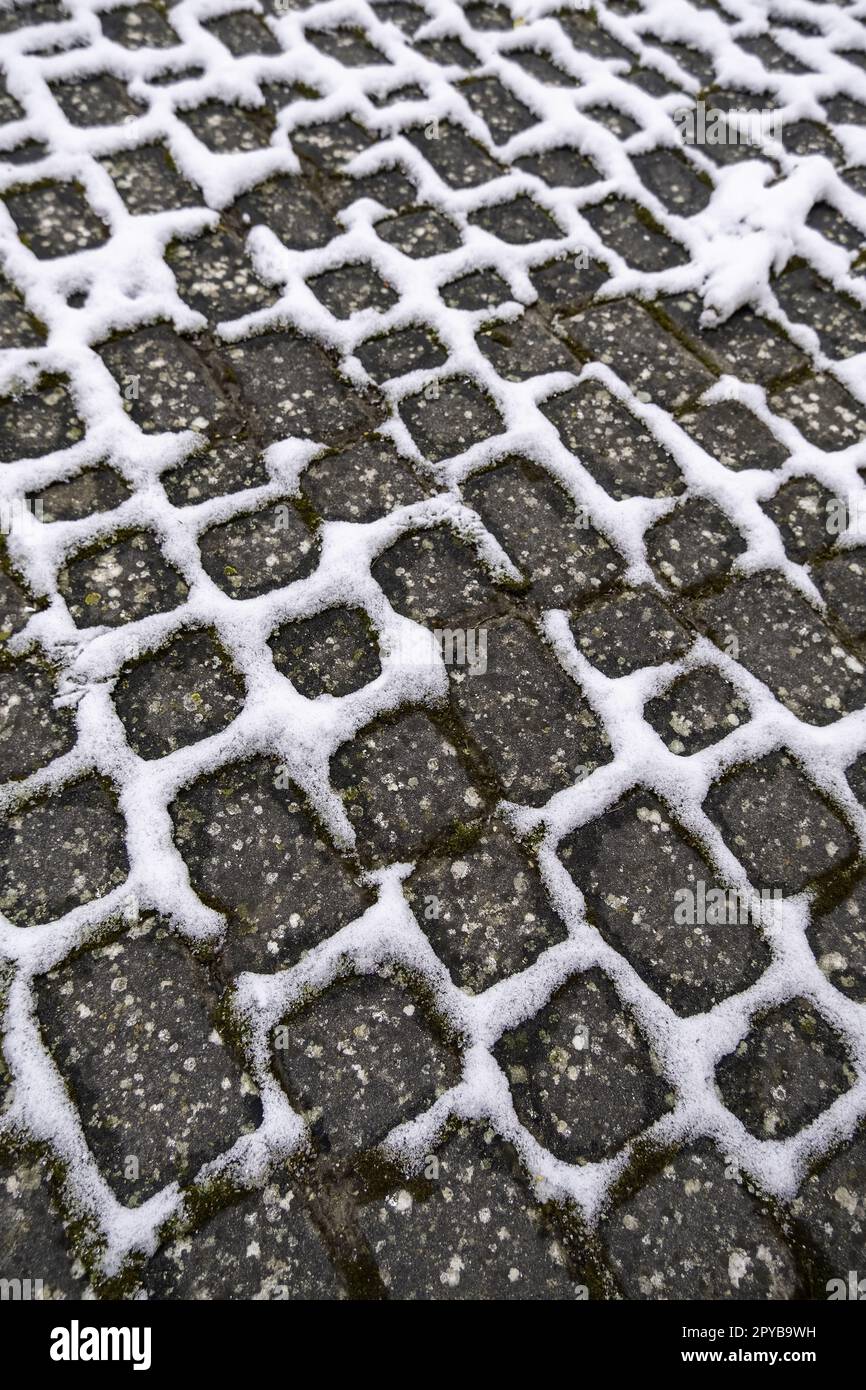 Snowy cobblestone floor Stock Photo Alamy