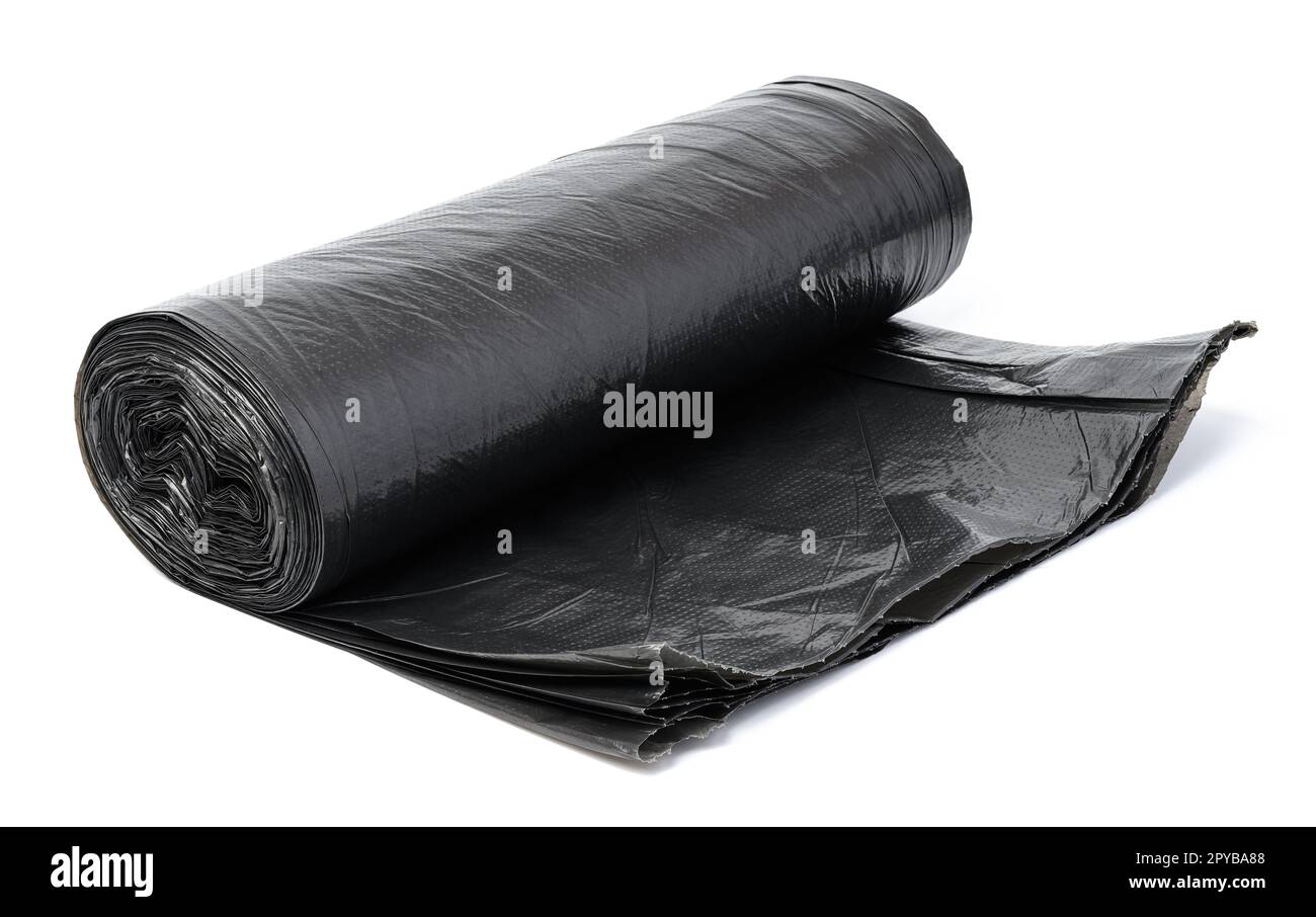 Twisted black polyethylene garbage bags on a white isolated background Stock Photo