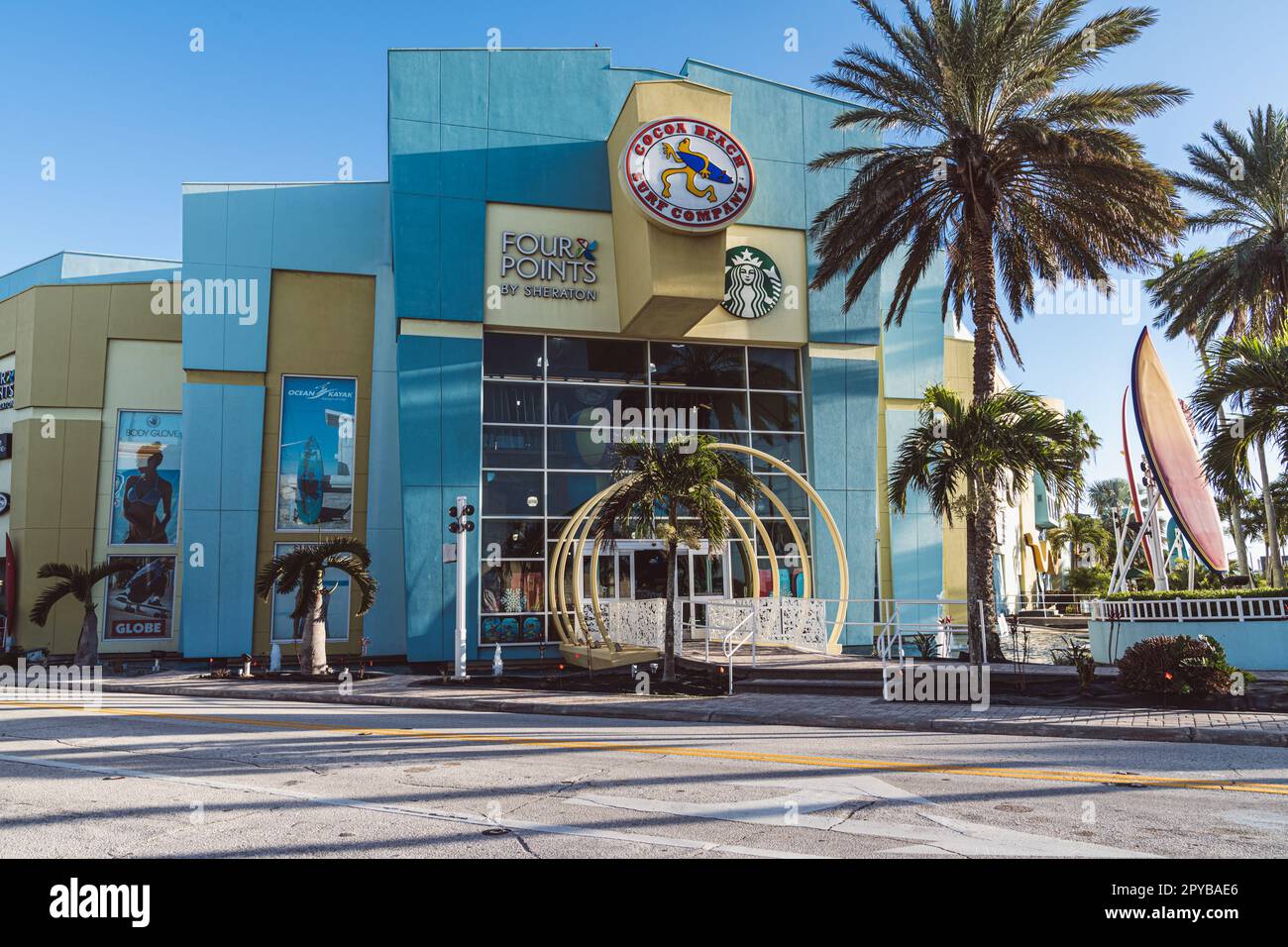 Cocoa Beach, Florida - December 29, 2022: Outside of the Four Points by Sheraton hotel, with the Cocoa Beach Surf Company store and a Starbucks Stock Photo