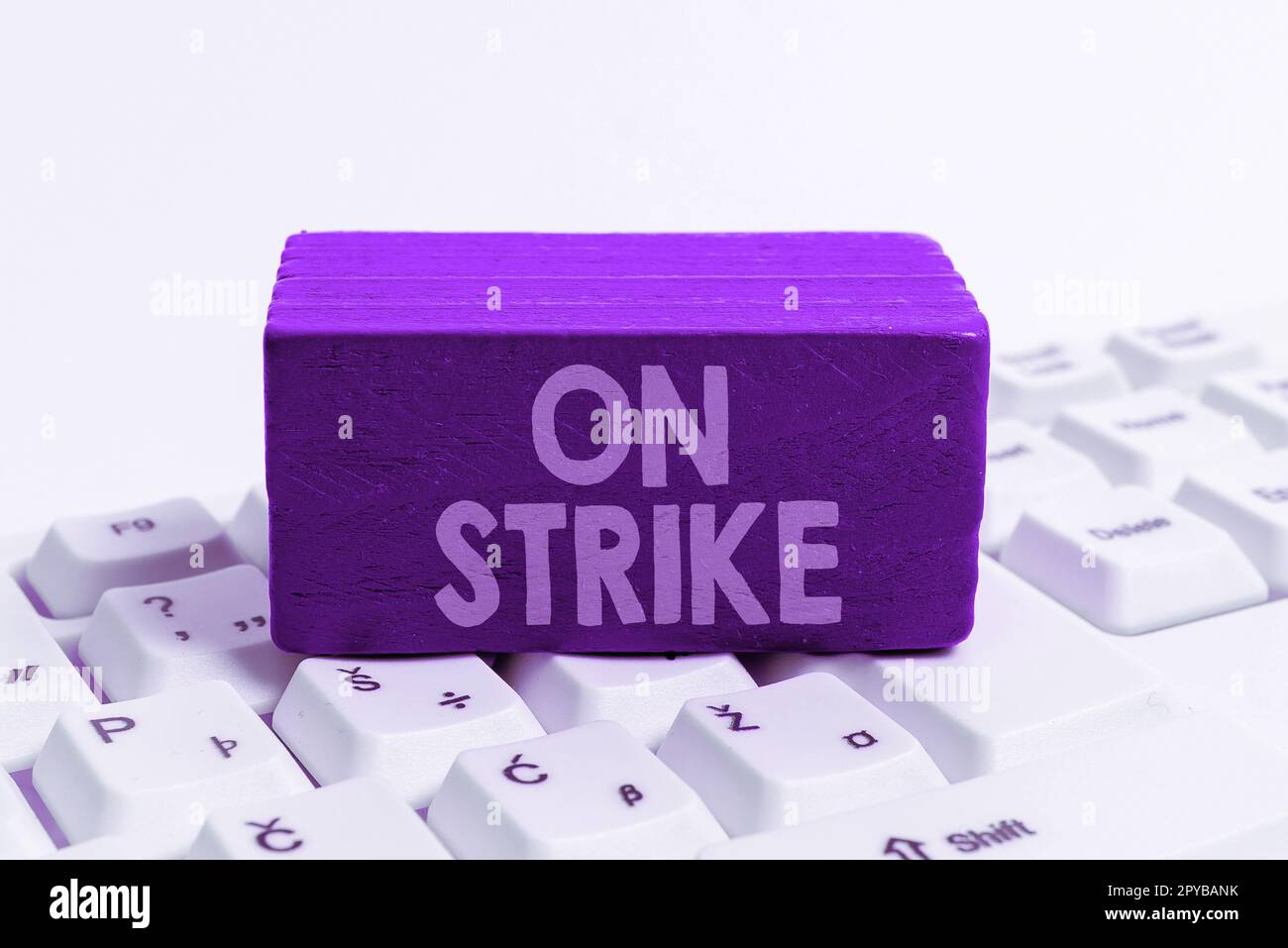 Handwriting text On Strike. Word for refuse to continue working because of an argument with an employer Stock Photo