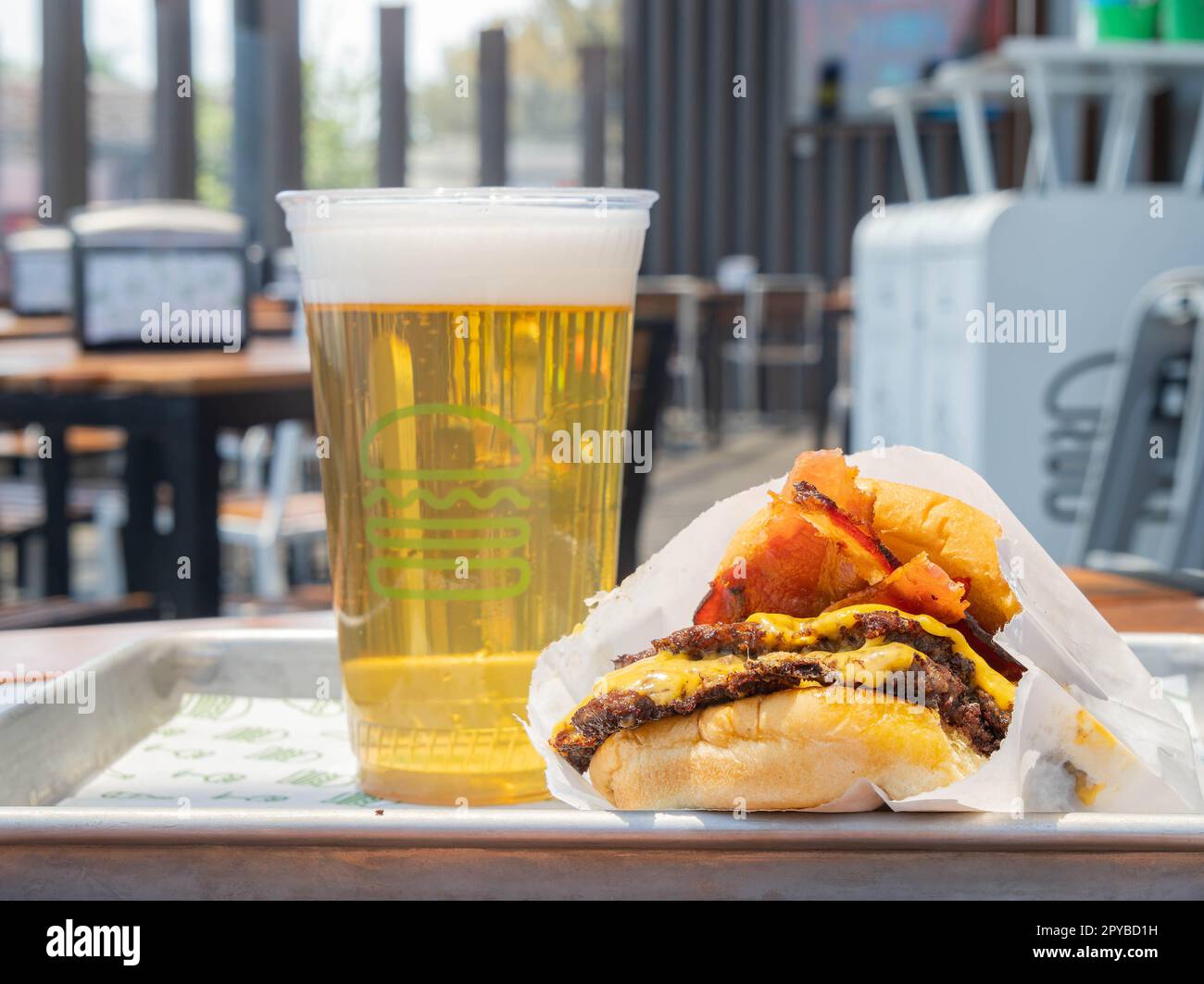 Mexico, APR 27 2023 - Close up shot of beer and burger from Shake Shack and burger Stock Photo