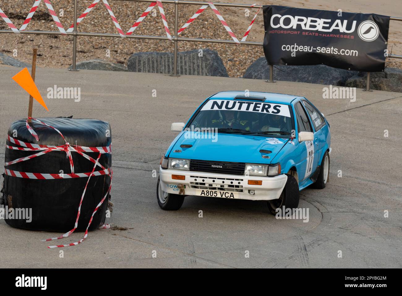 Robert Nutter racing a Toyota Corolla AE86 competing in the Corbeau Seats rally on the seafront at Clacton, Essex, UK. Co driver Simon Nutter Stock Photo