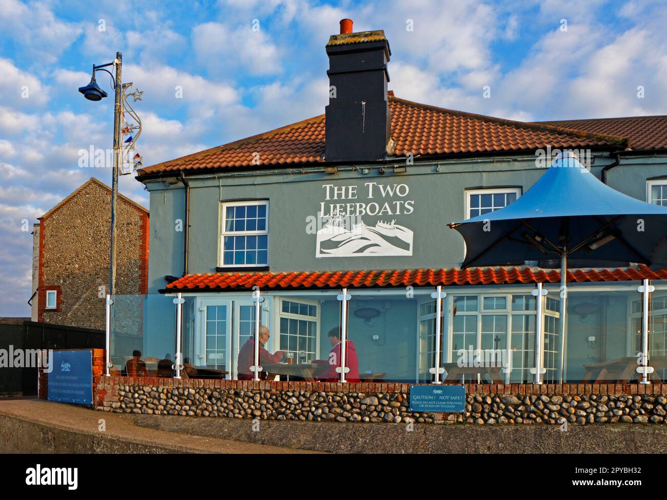 a-view-of-the-two-lifeboats-inn-and-hotel-with-outside-seating