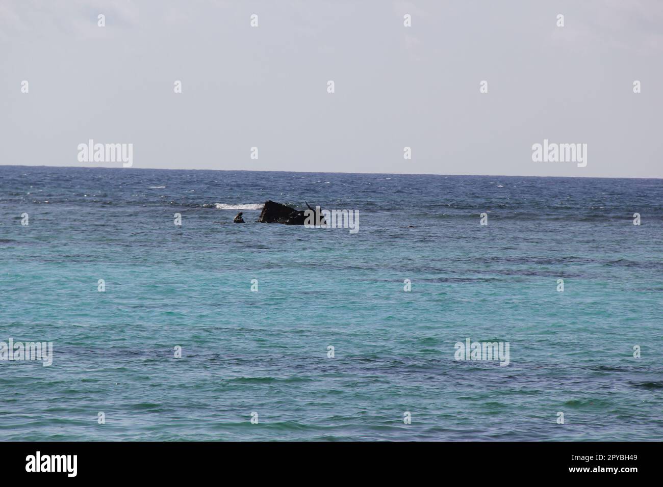sunken boat in ocean Stock Photo
