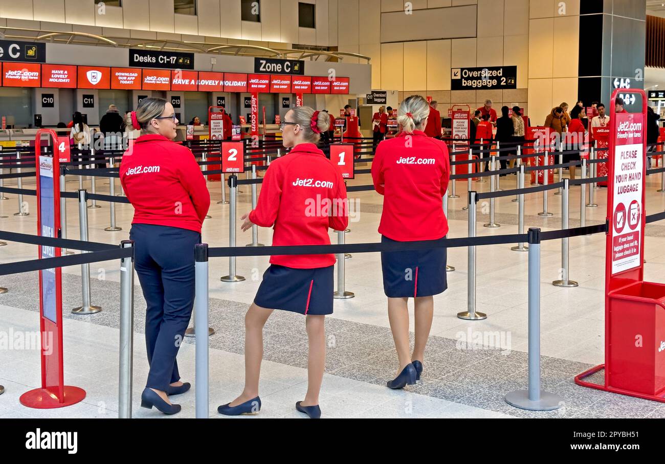 Jet2 check-in staff at Manchester International Airport, England, UK, M90 1QX Stock Photo