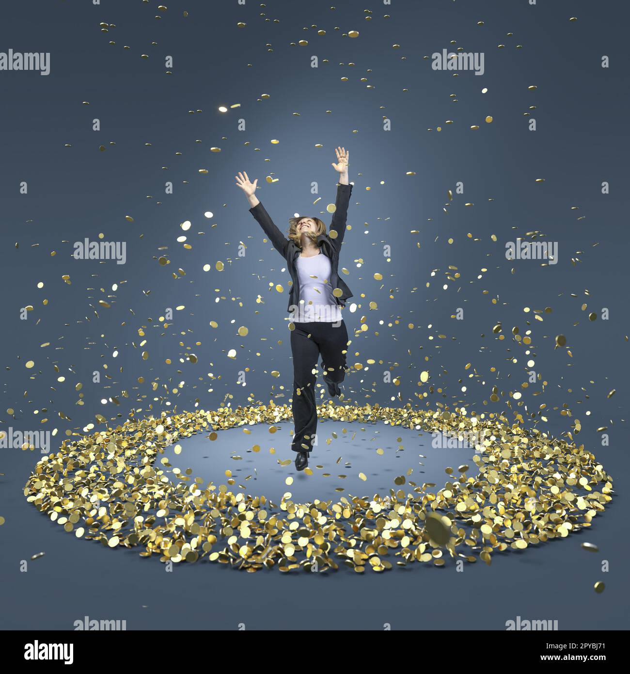 businesswoman jumps happily into a circle of gold coins Stock Photo
