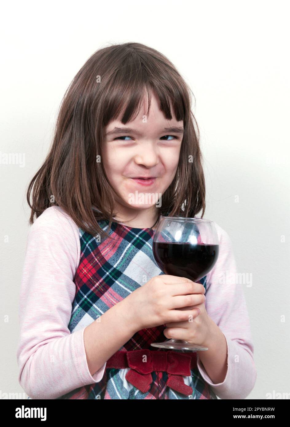 Child girl with the glass of wine Stock Photo Alamy