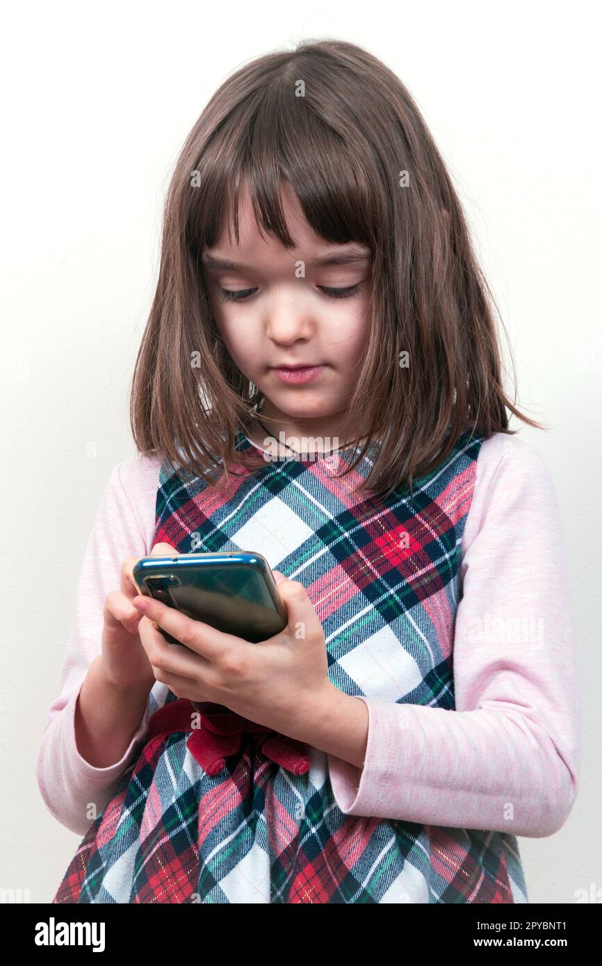 Little child girl with the phone Stock Photo