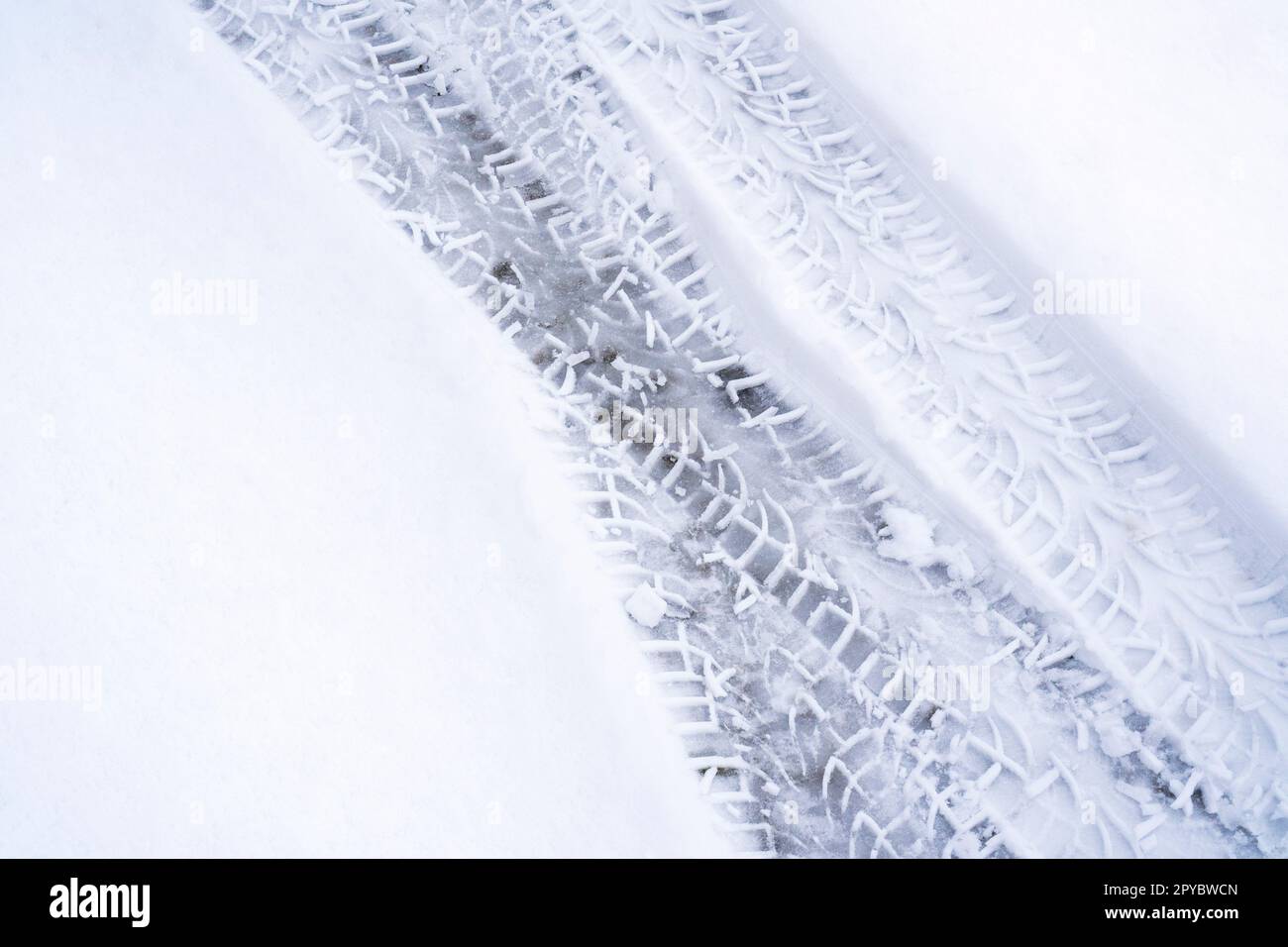 Trace of car tire in the fresh snow Stock Photo