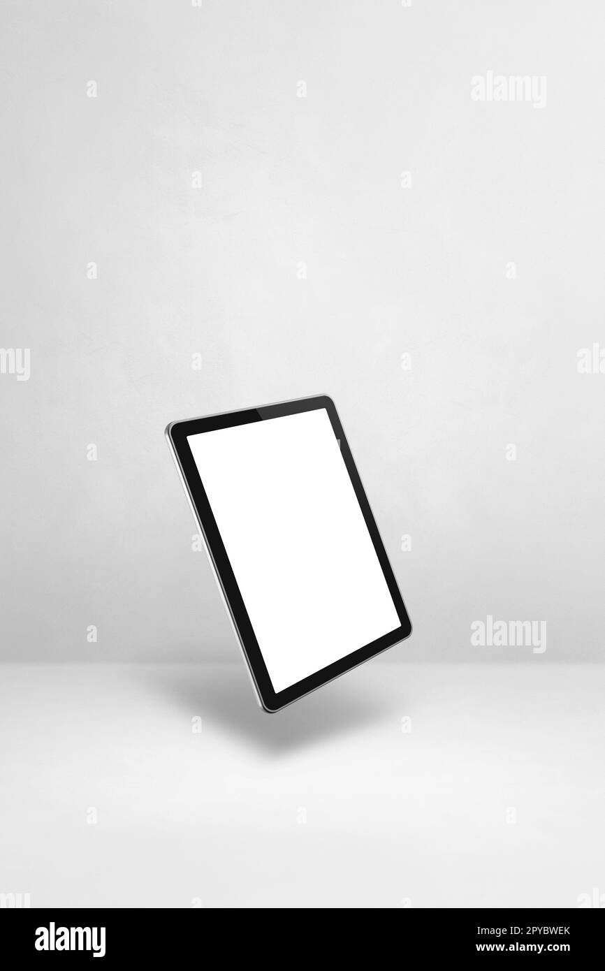 Floating tablet pc computer isolated on white. Vertical background Stock Photo