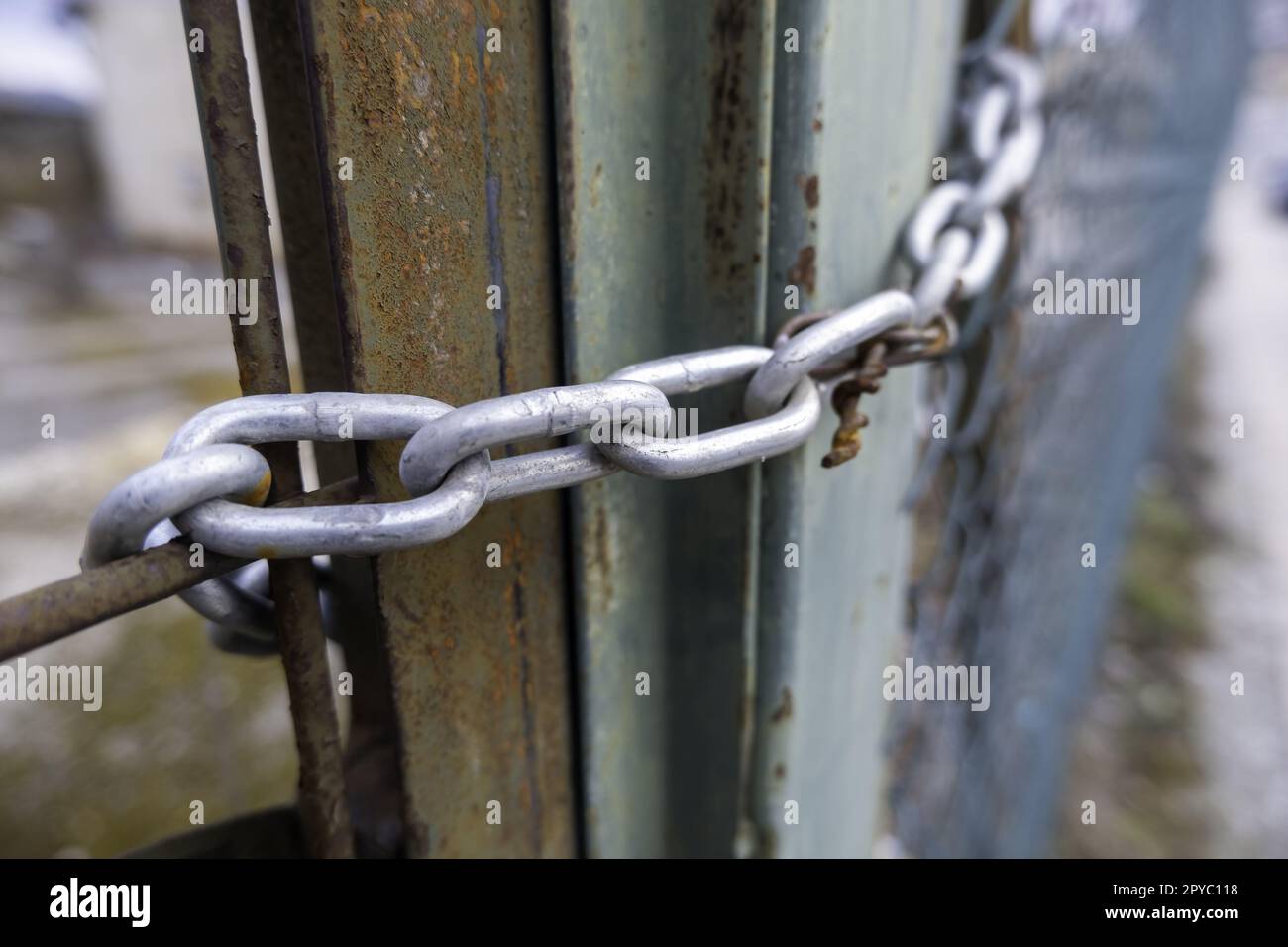 Chain closing a door Stock Photo
