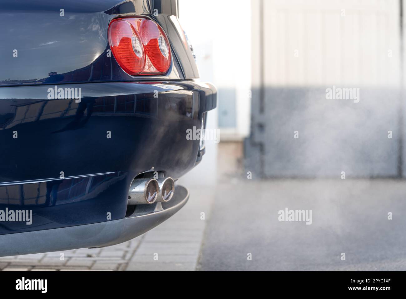 smoke from the exhaust of a car with a gasoline engine Stock Photo