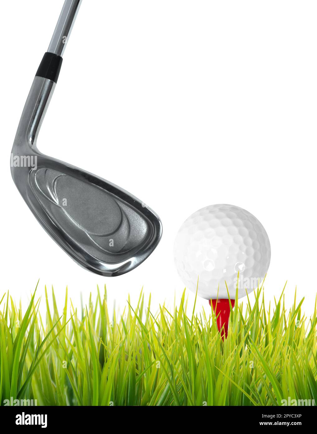 Golf game with club hitting a ball on the lawn Stock Photo