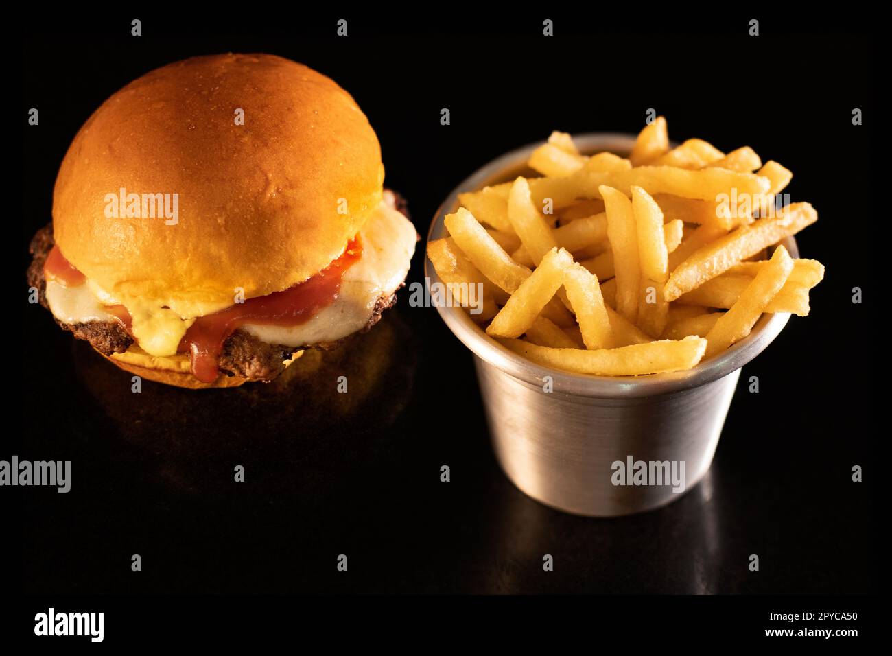 Fresh tasty burger on black Stock Photo
