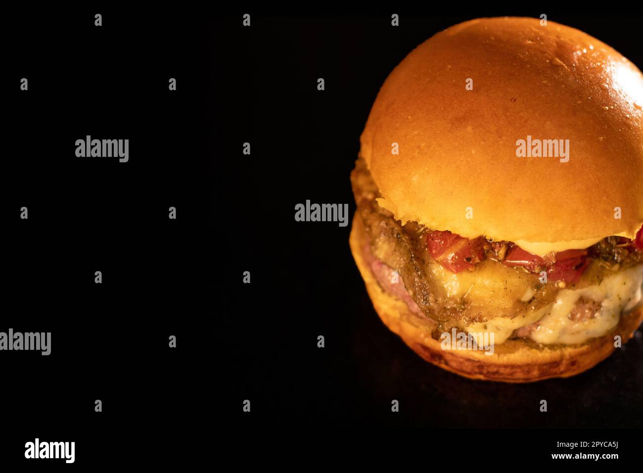Fresh tasty burger on black Stock Photo
