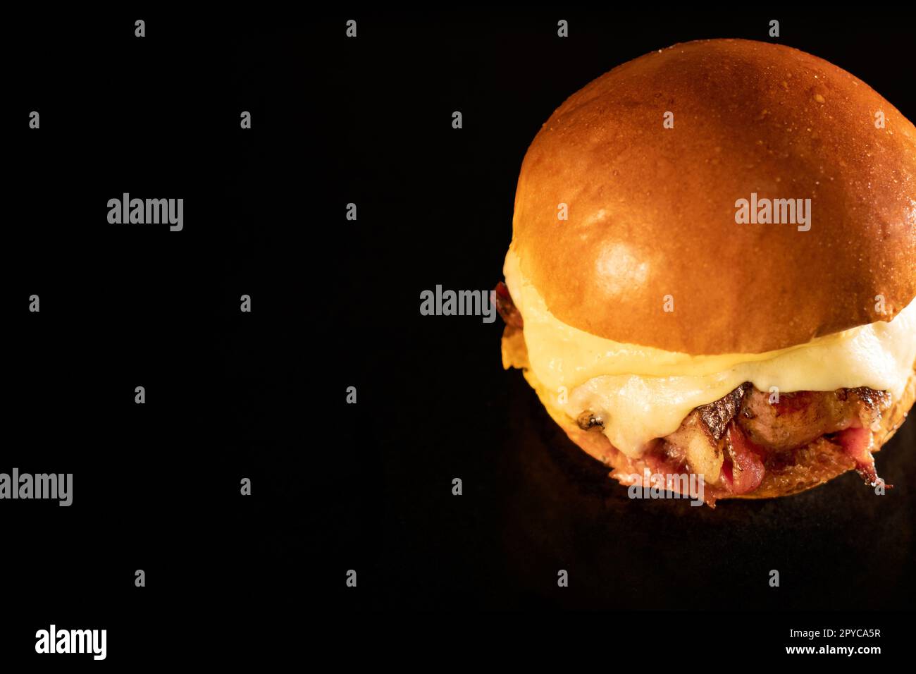 Fresh tasty burger on black Stock Photo