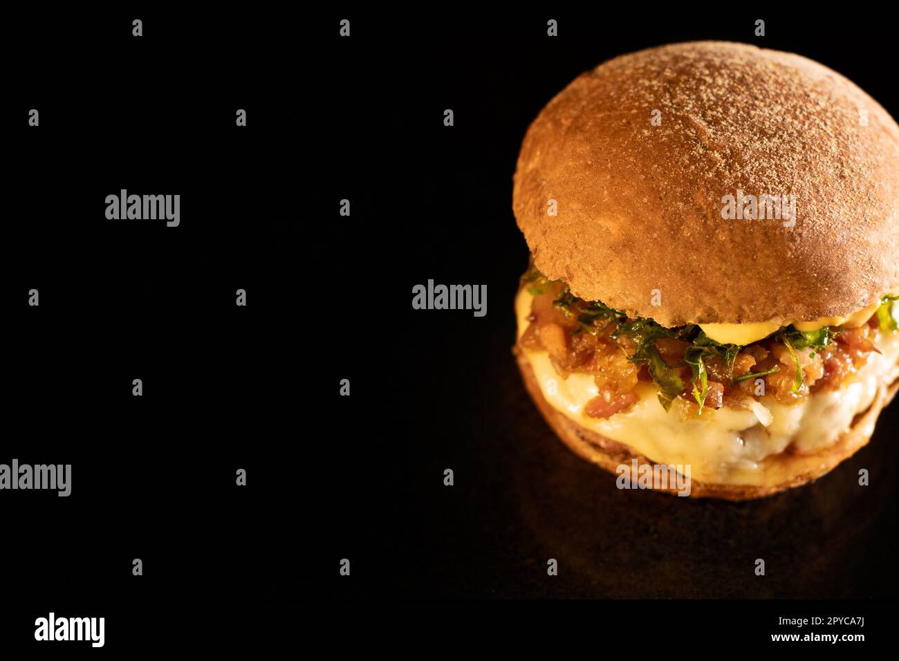 Fresh tasty burger on black Stock Photo