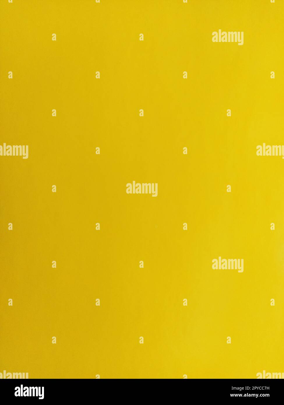 Nice yellow background. A sheet of paper close-up. Pure cheerful color. Vivid shade of yellow Stock Photo