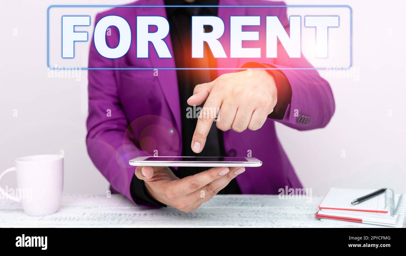 Hand writing sign For Rent. Word for when you make property available for purchasing temporarily Stock Photo