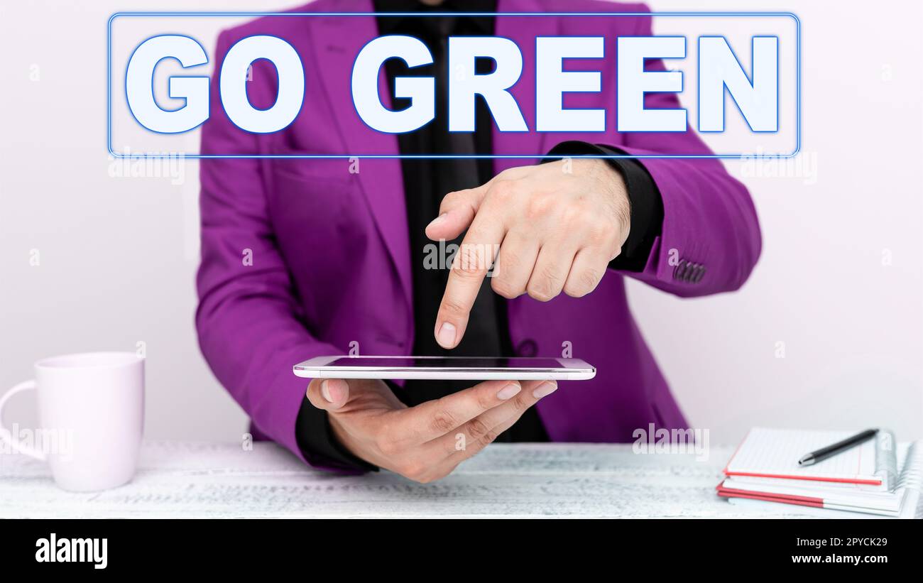 Sign displaying Go Green. Business showcase making more environmentally friendly decisions as