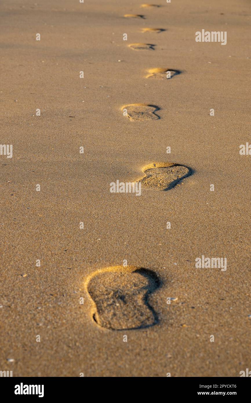 Close up shot of some footprints on the sand Stock Photo