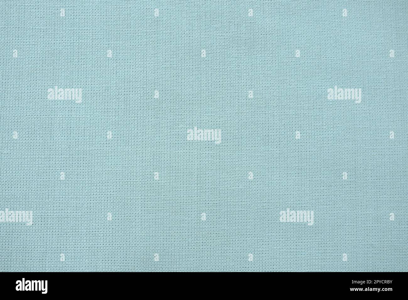 texture of natural light green or blue fabric close-up. The texture of the fabric is made of natural cotton or linen textile material. Green canvas background. Smooth surface of mint-colored fabric Stock Photo