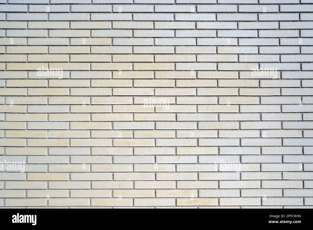 Background from a beige clinkered wall Stock Photo