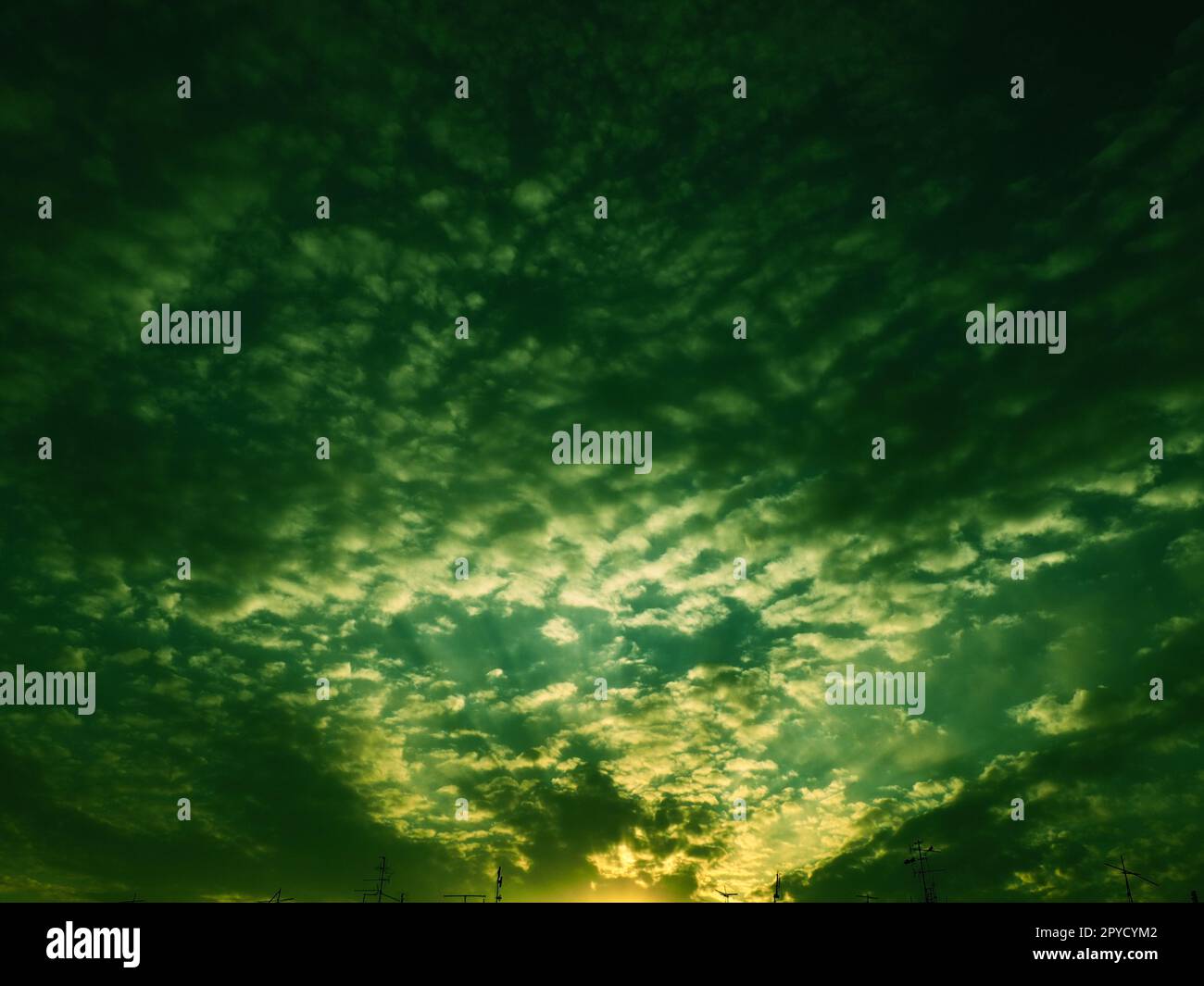 Wonderful sunset. Clouds in the evening sky. The sun's rays pierce the