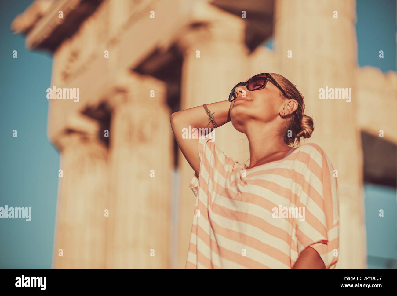Happy female tourist looking up hi-res stock photography and images - Alamy