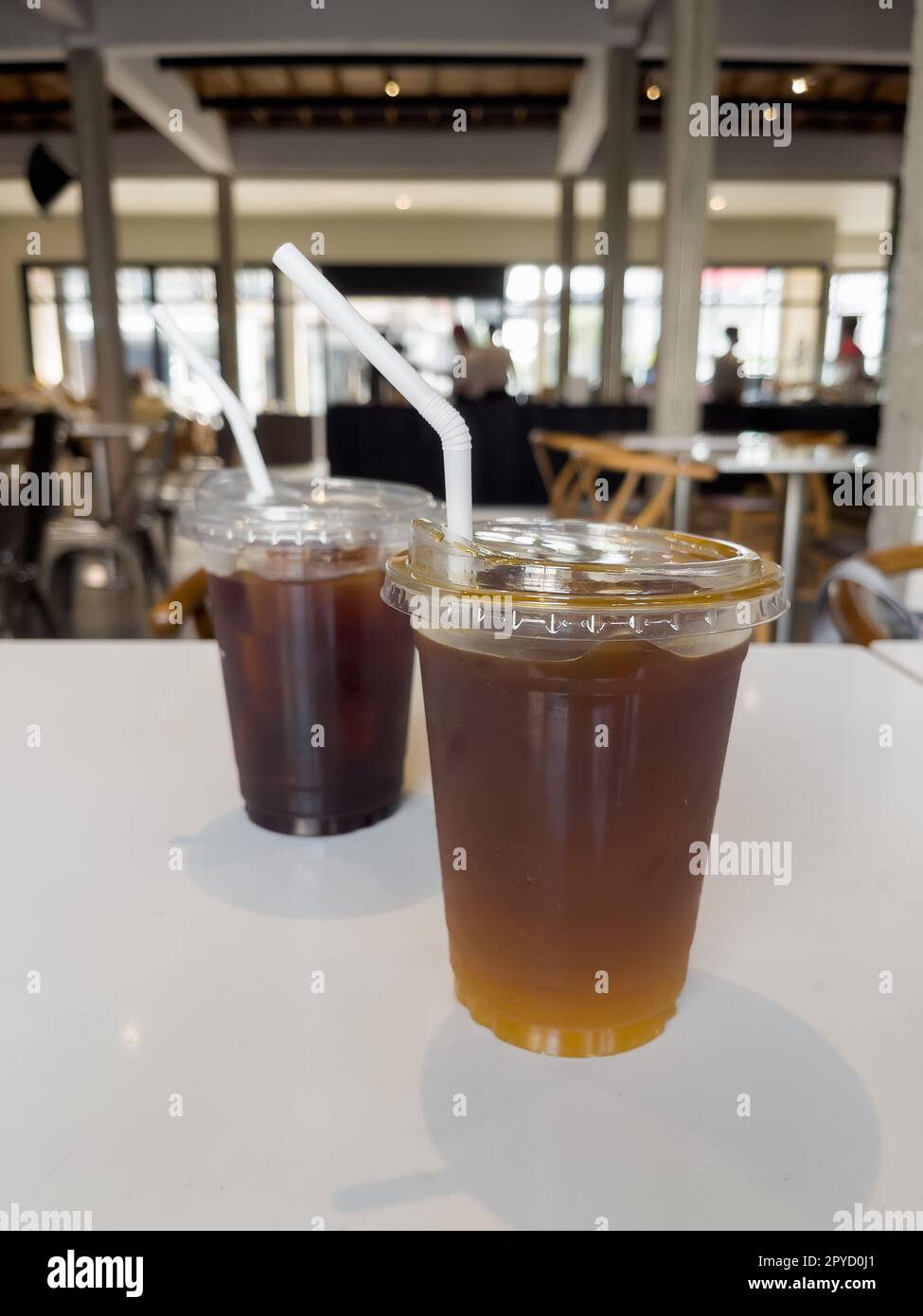 Iced americano with orange and iced americano in coffee shop Stock