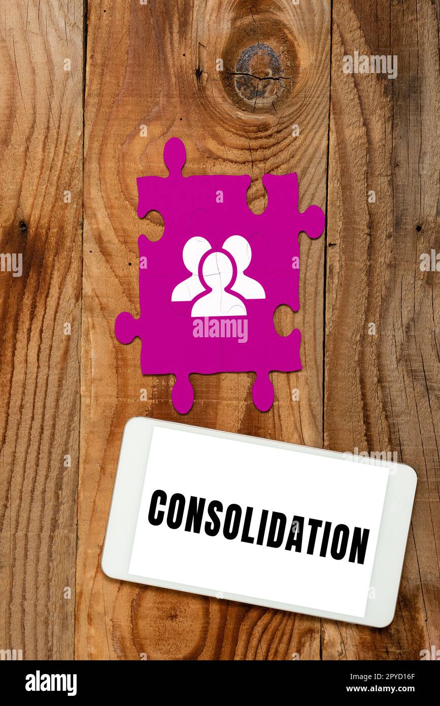 Text sign showing Consolidation. Business approach Action or process of making something stronger or more solid Stock Photo