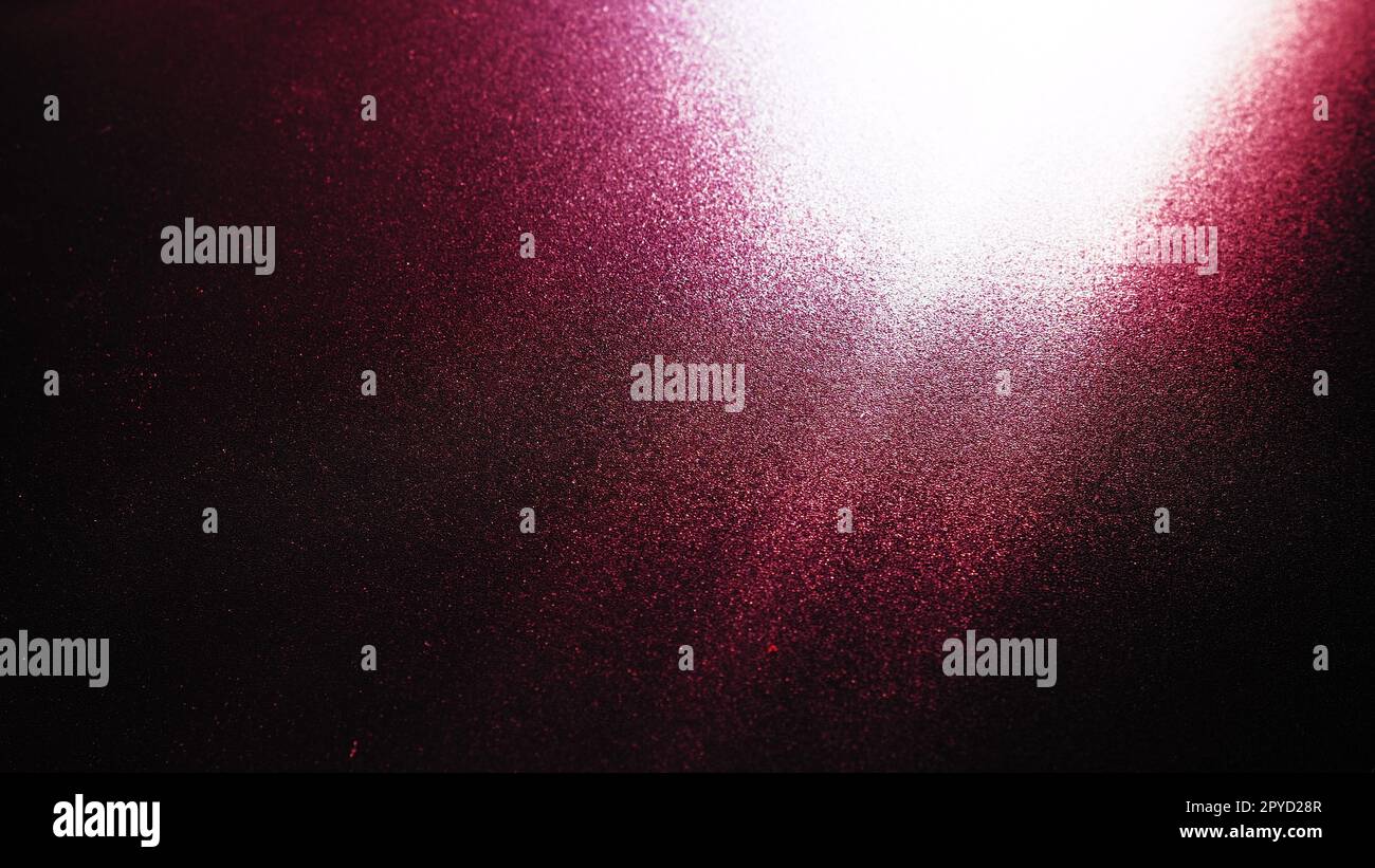 Diagonal rays of light on a red, burgundy and black background. Blurred ...