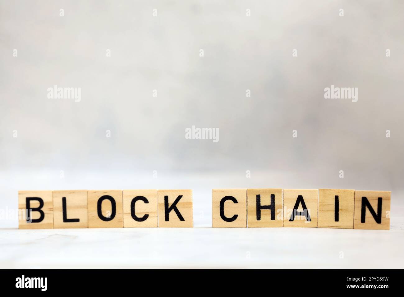 Blockchain text on wooden cubes, cryptocurrency,technology binary code, ditigal data and secure money, ledger bitcoin concept copy space background Stock Photo