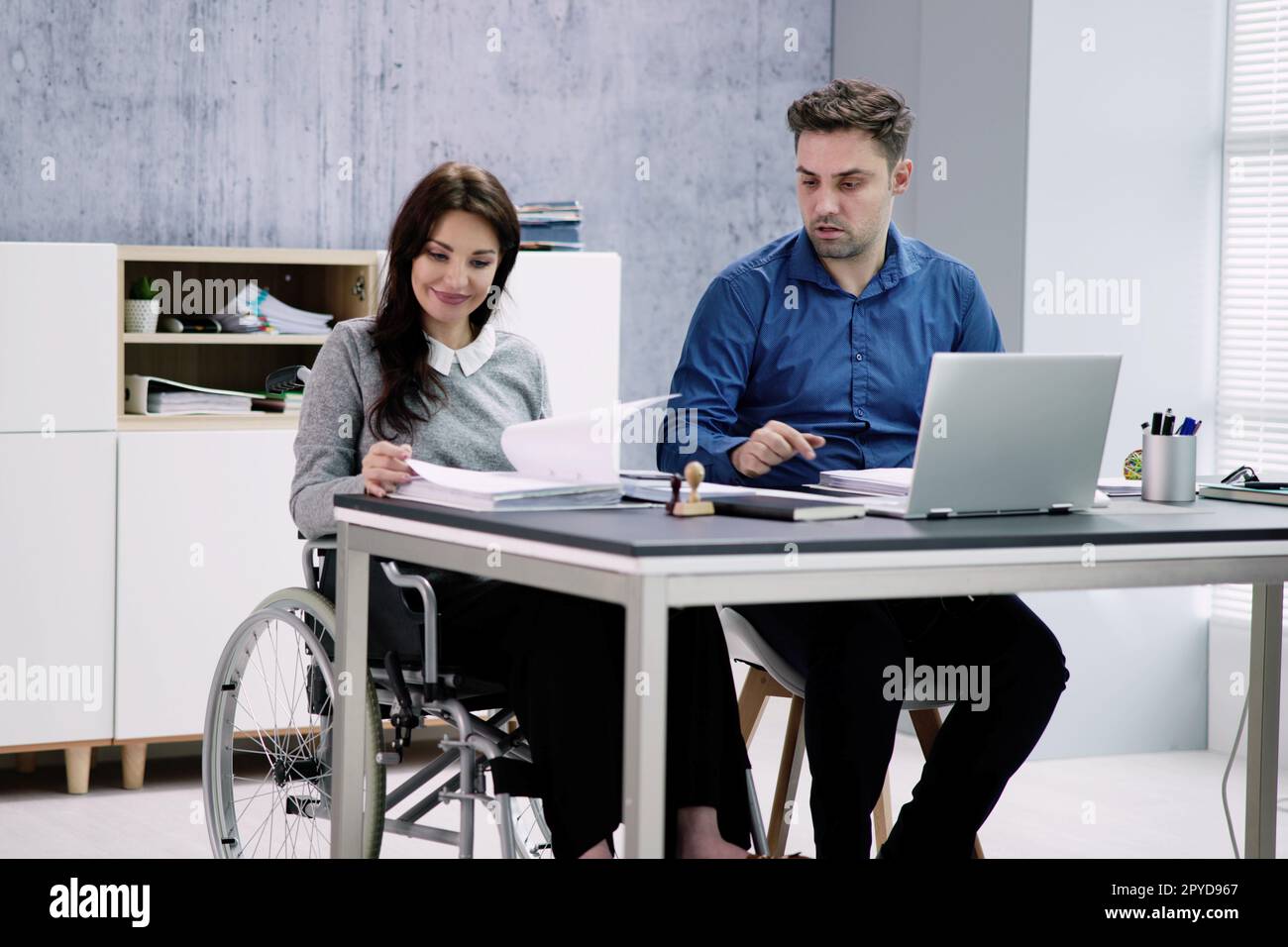 Chartered Accountant In Office With Calculator Stock Photo