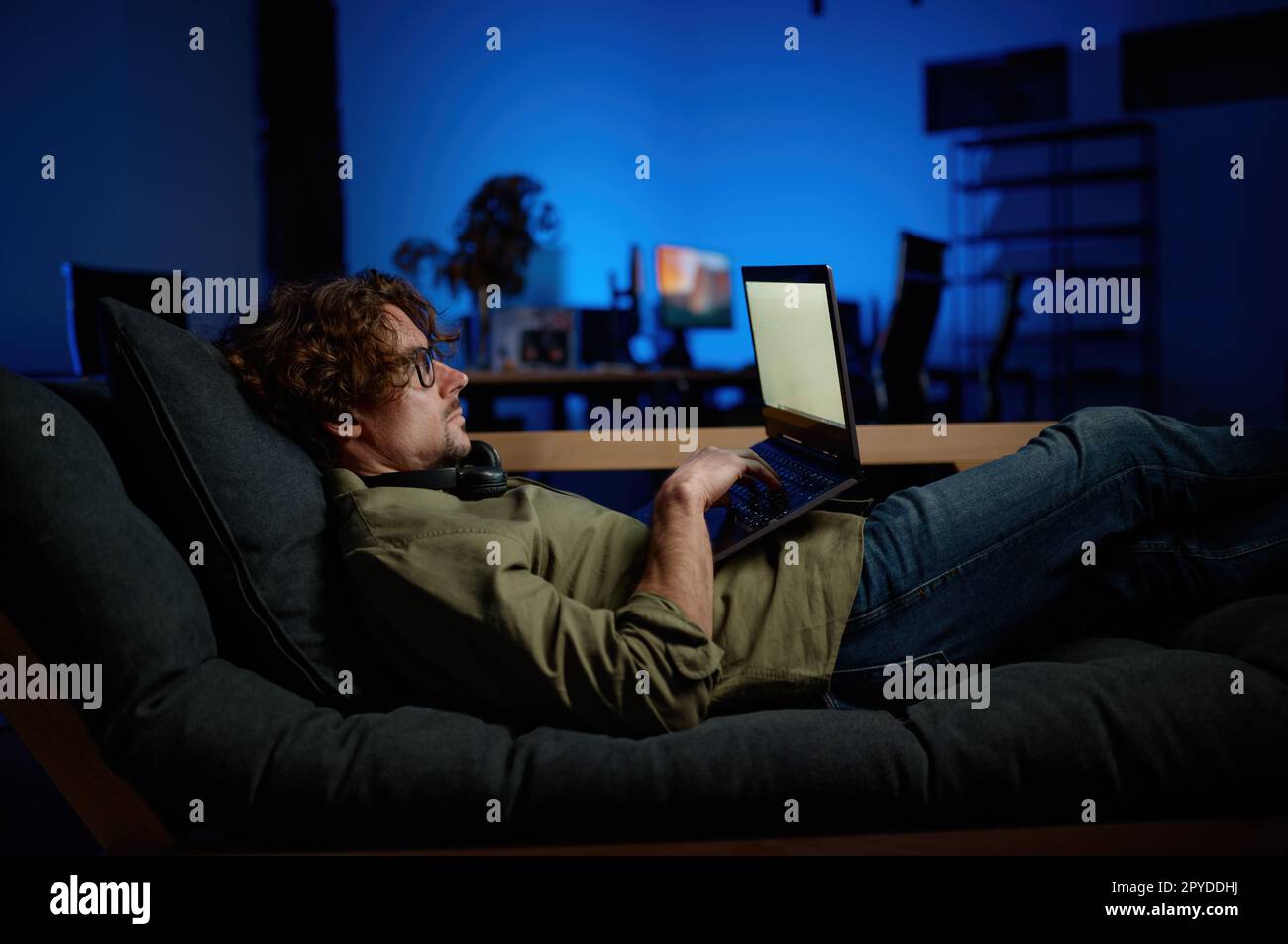 Computer Couch Rest Man IT administrator rest on sofa with laptop computer lying on sofa ...