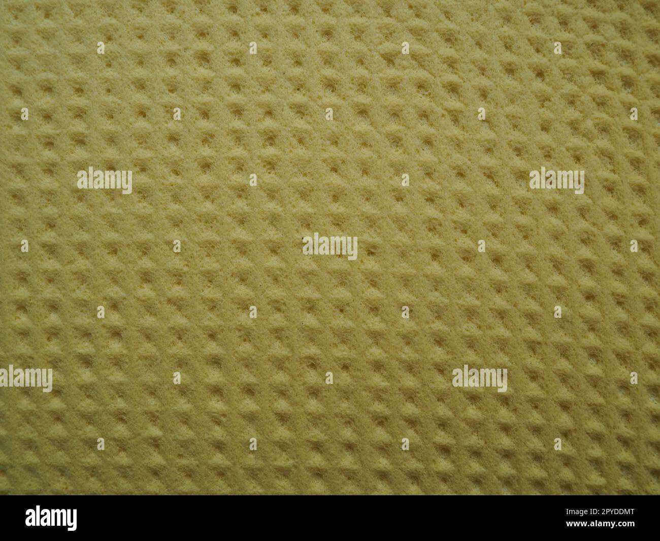 Sponge fibers sponge texture pattern surface close-up yellow brown background Stock Photo