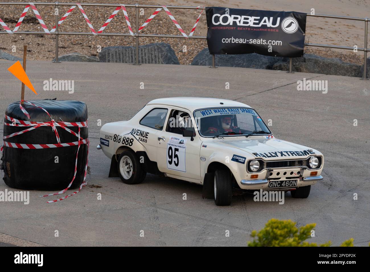 Edward Welham racing a classic 1974 Ford Escort Mk1 competing in the Corbeau Seats rally on the seafront at Clacton, Essex, UK. Co driver Stuart Rodd Stock Photo