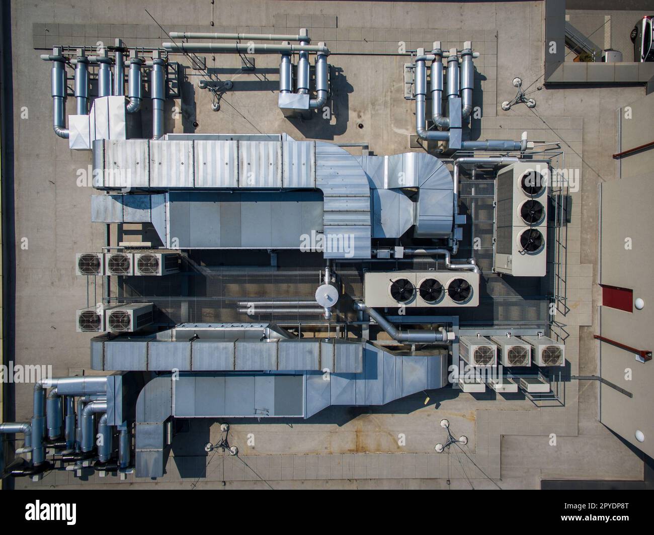 Air conditioning system on the roof of the building, advanced air conditioning and ventilation system, aerial view down the roof of the house, many different ventilation ducts Stock Photo