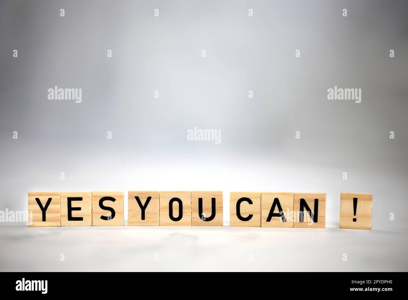 Yes you can text wooden cubes . Positive thinking, motivation, attitude and confidence concept. bright background texture with copy space Stock Photo