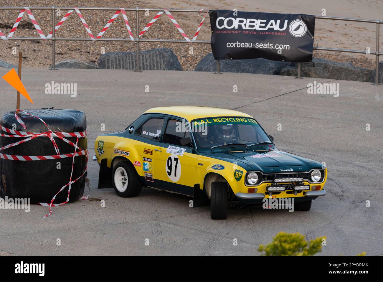 Dave Truscott racing a classic 1972 Ford Escort Mk1 competing in the Corbeau Seats rally on the seafront at Clacton, Essex, UK. Co driver Andy Simpson Stock Photo