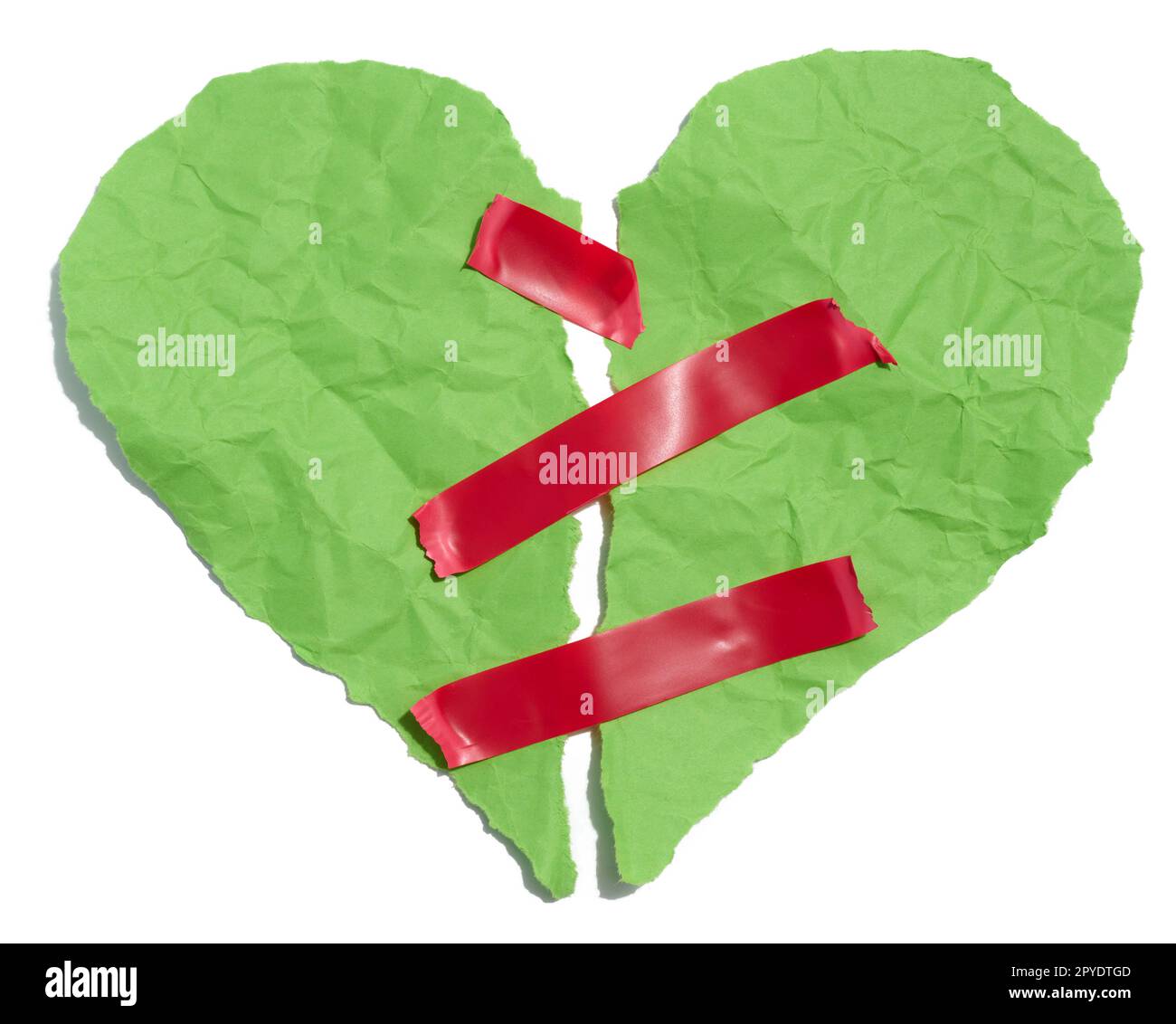 Torn heart made of green crumpled paper fastened with red electrical tape on a white background Stock Photo