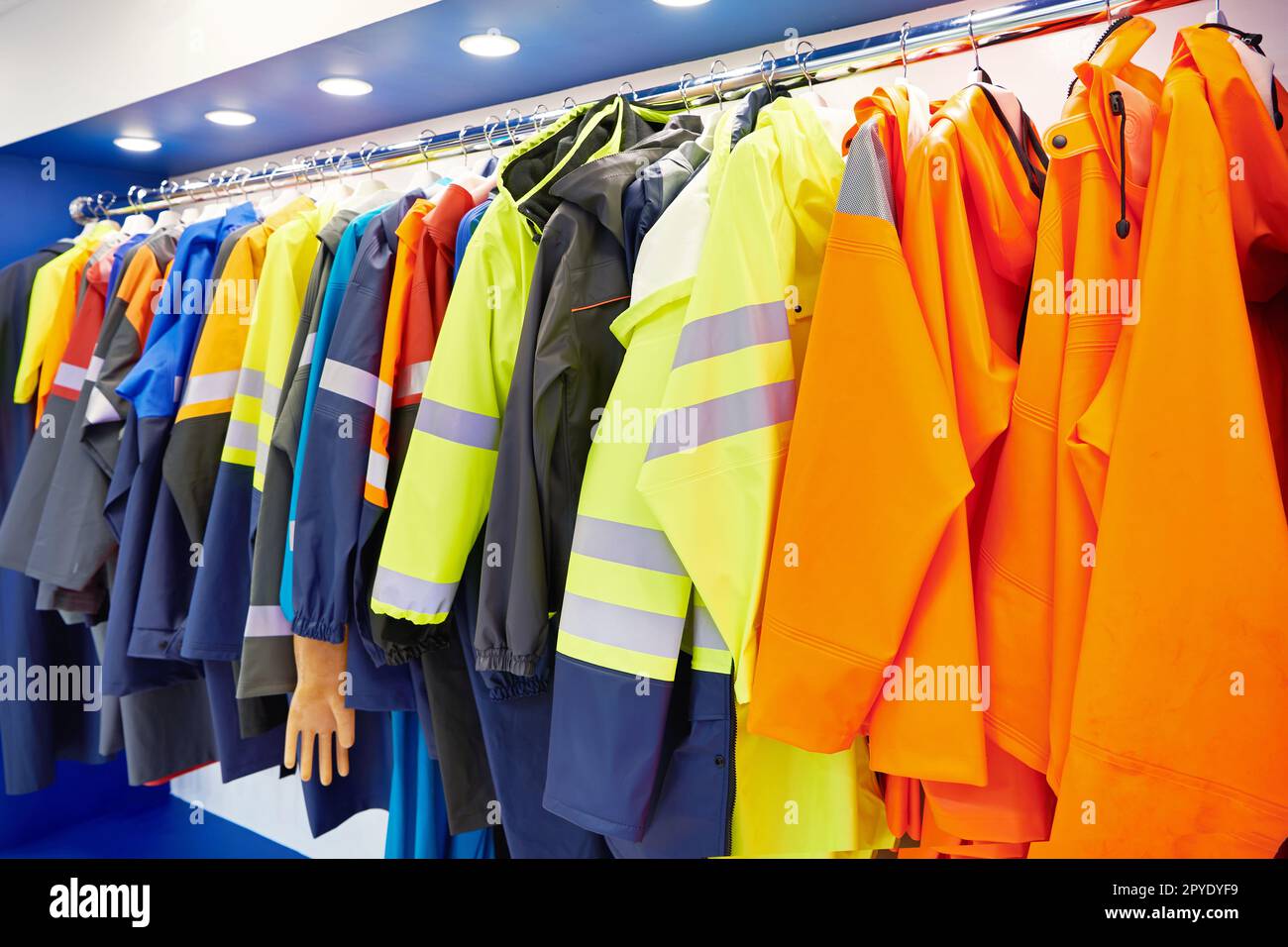Waterproofing reflective clothing for road workers in store Stock Photo