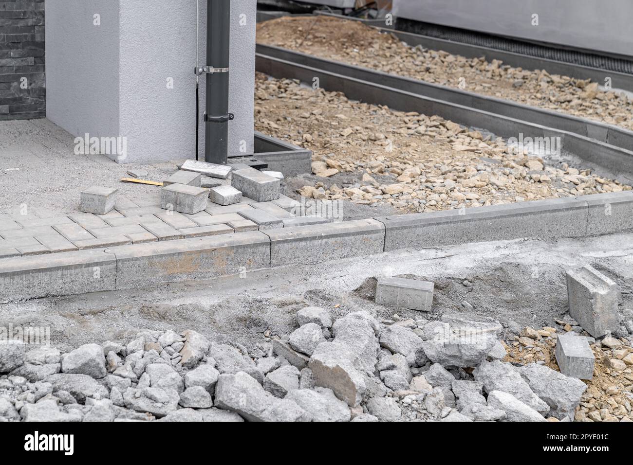 concrete block paving for the construction of a sidewalk Stock Photo