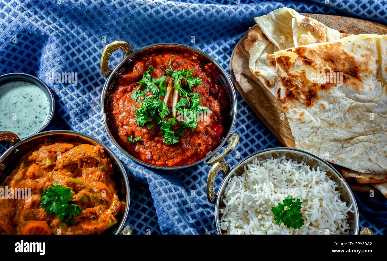 Hot madras paneer and vegetable masala with basmati rice served in