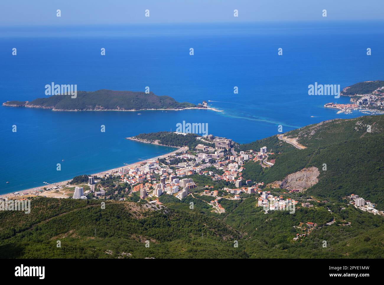 View of the city from the top of the mountain road. View of the coast and the city of Budva Riviera. Montenegro, Balkans, Adriatic Sea, Europe. Stock Photo